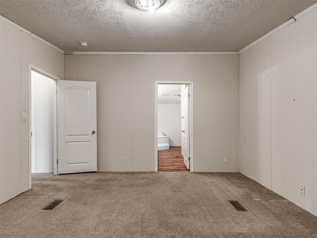 355370 E 970th Rd, Sparks, OK 74869 - carpeted spare room featuring crown molding and a textured ceiling
