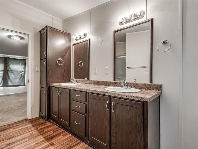 355370 E 970th Rd, Sparks, OK 74869 - full bathroom with double vanity and wood finished floors