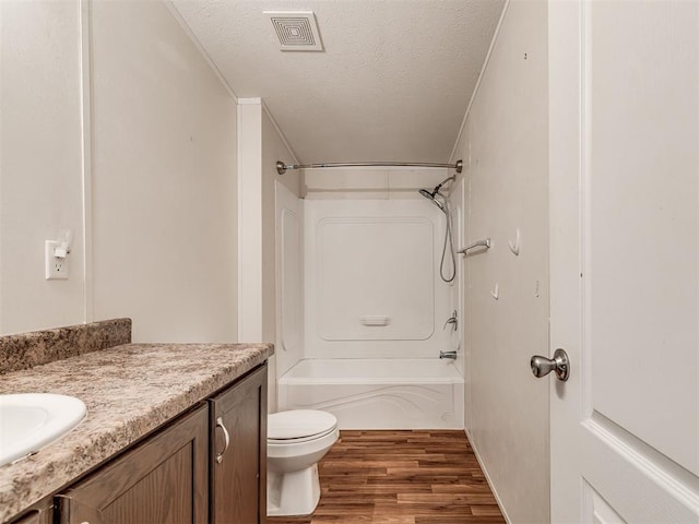 355370 E 970th Rd, Sparks, OK 74869 - full bath with a textured ceiling, wood finished floors, shower / bath combination, and vanity