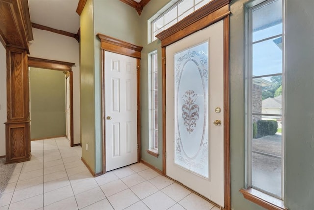 12417 Sussex Dr, Oklahoma City, OK 73130 - foyer entrance featuring plenty of natural light, ornamental molding, and light tile patterned floors
