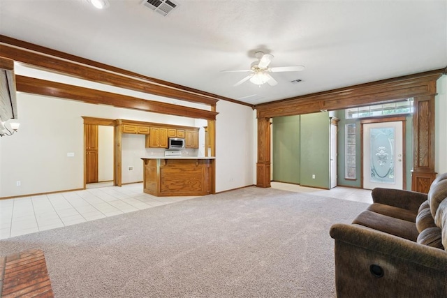 12417 Sussex Dr, Oklahoma City, OK 73130 - living area with ceiling fan, light carpet, light tile patterned floors, and ornamental molding