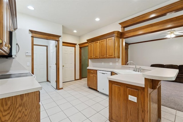 12417 Sussex Dr, Oklahoma City, OK 73130 - kitchen featuring dishwasher, open floor plan, a peninsula, stainless steel microwave, and light countertops