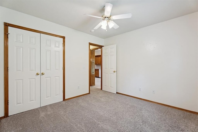 12417 Sussex Dr, Oklahoma City, OK 73130 - unfurnished bedroom with light carpet, a closet, and ceiling fan