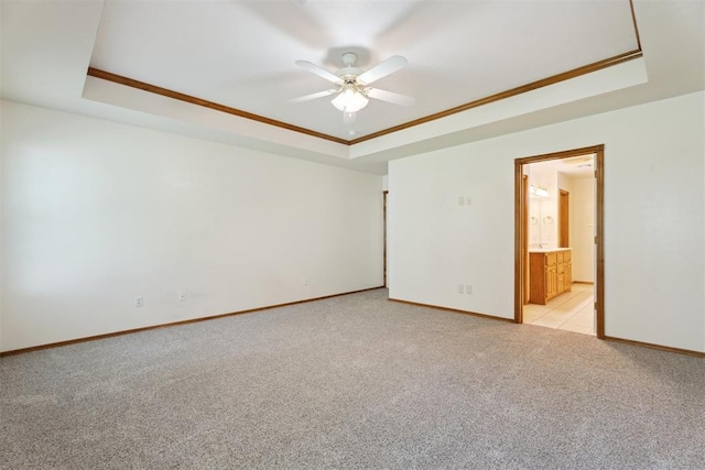 12417 Sussex Dr, Oklahoma City, OK 73130 - empty room with a tray ceiling, light colored carpet, a ceiling fan, and ornamental molding