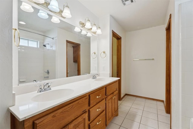 12417 Sussex Dr, Oklahoma City, OK 73130 - bathroom featuring double vanity, a shower, and tile patterned flooring