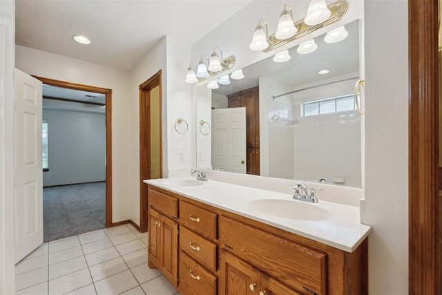 12417 Sussex Dr, Oklahoma City, OK 73130 - bathroom featuring double vanity, a shower, and tile patterned floors
