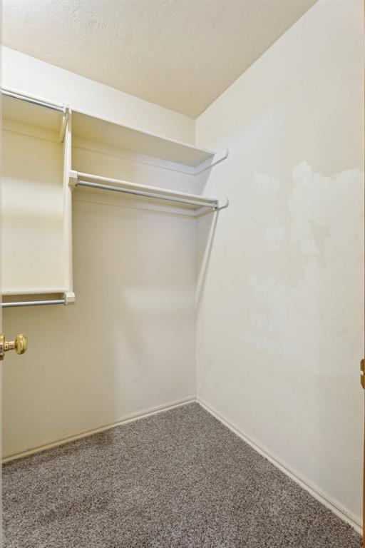 12417 Sussex Dr, Oklahoma City, OK 73130 - spacious closet featuring carpet