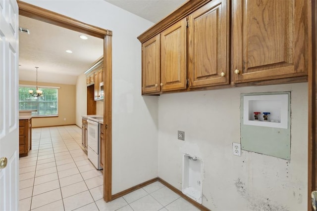 12417 Sussex Dr, Oklahoma City, OK 73130 - laundry room featuring cabinet space, hookup for a washing machine, light tile patterned floors, electric dryer hookup, and a chandelier