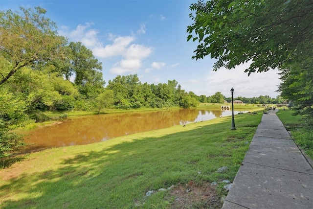 12417 Sussex Dr, Oklahoma City, OK 73130 - view of community with a water view and a yard