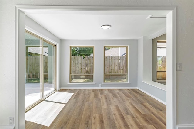 2104 Brookhaven Dr, Edmond, OK 73034 - empty room with wood finished floors and baseboards