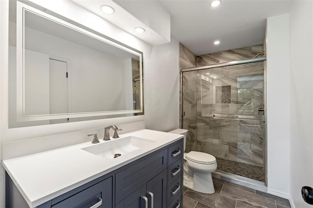2104 Brookhaven Dr, Edmond, OK 73034 - bathroom featuring vanity, a stall shower, and recessed lighting