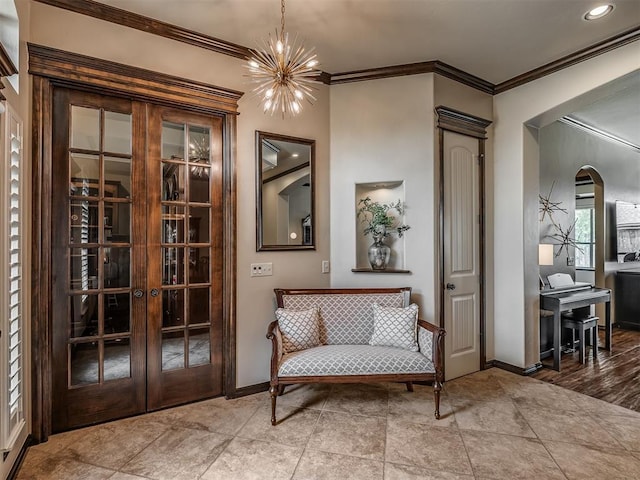 16208 Windrush Pl, Edmond, OK 73013 - living area with a chandelier, ornamental molding, arched walkways, and french doors