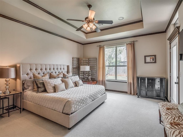 16208 Windrush Pl, Edmond, OK 73013 - bedroom featuring light carpet, a tray ceiling, ornamental molding, and ceiling fan
