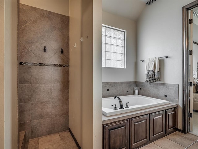 16208 Windrush Pl, Edmond, OK 73013 - full bathroom with a garden tub, tiled shower, and tile patterned floors