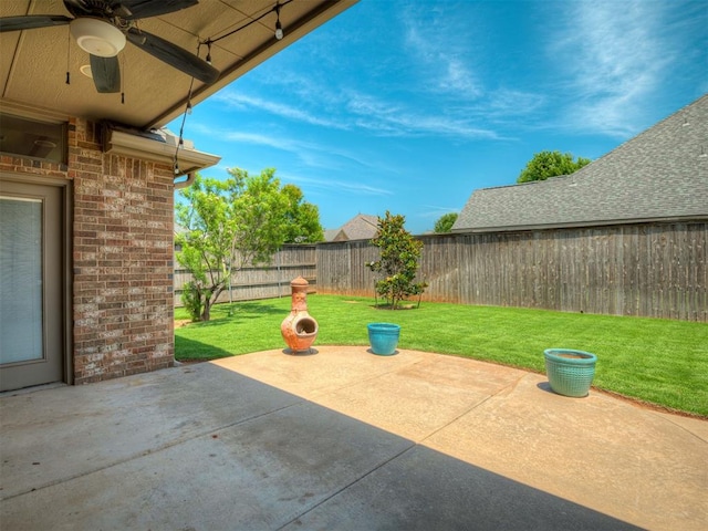 16208 Windrush Pl, Edmond, OK 73013 - fenced backyard featuring a ceiling fan and a patio area
