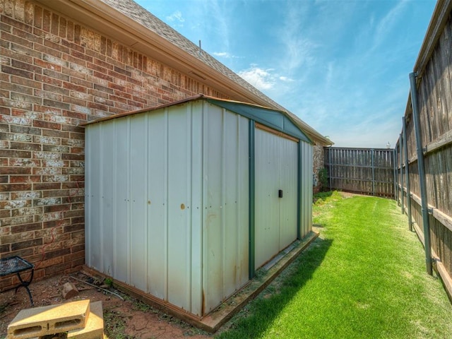 16208 Windrush Pl, Edmond, OK 73013 - view of shed with a fenced backyard