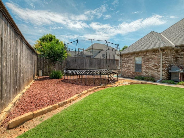16208 Windrush Pl, Edmond, OK 73013 - fenced backyard with a trampoline