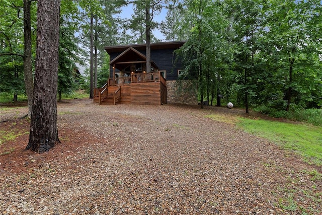 180 Black Jack Trl, Hochatown, OK 74728 - rustic home with stairway and a porch