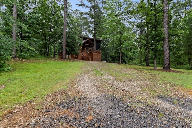 180 Black Jack Trl, Hochatown, OK 74728 - view of green lawn with stairway and a wooded view