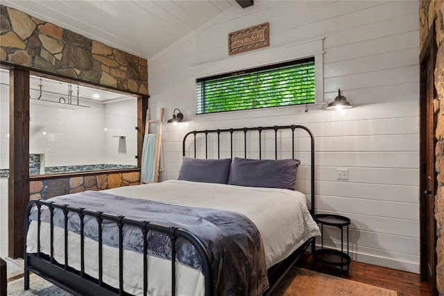 180 Black Jack Trl, Hochatown, OK 74728 - bedroom featuring lofted ceiling, wood finished floors, and wood walls