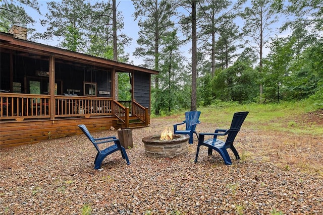 180 Black Jack Trl, Hochatown, OK 74728 - view of yard featuring a fire pit and a wooden deck