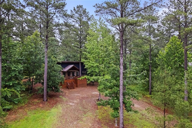 180 Black Jack Trl, Hochatown, OK 74728 - view of yard featuring stairs, a view of trees, and a wooden deck