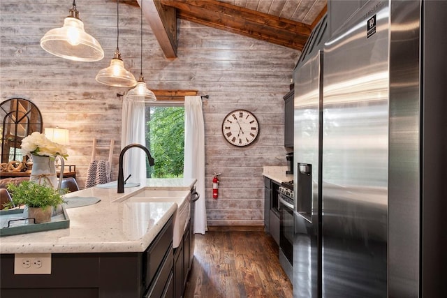 180 Black Jack Trl, Hochatown, OK 74728 - kitchen featuring stainless steel appliances, wood walls, dark wood finished floors, light stone counters, and wood ceiling