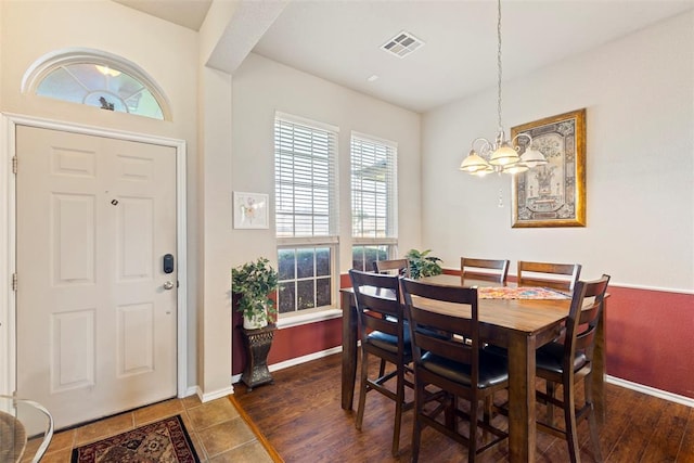 2321 NW 162nd Ter, Edmond, OK 73013 - dining area featuring a chandelier and dark wood-type flooring