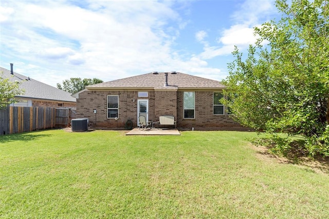 2321 NW 162nd Ter, Edmond, OK 73013 - back of property featuring brick siding and a patio area
