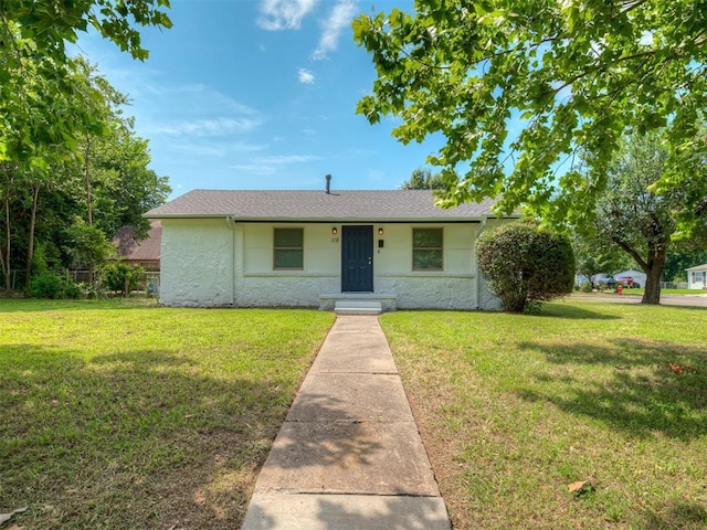 118 W Marshall Dr, Oklahoma City, OK 73110 - view of front of property with a front yard, stone siding, stucco siding, and roof with shingles