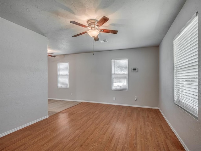 118 W Marshall Dr, Oklahoma City, OK 73110 - spare room featuring light wood-style floors and a ceiling fan