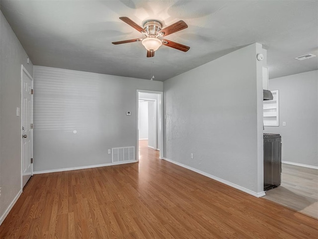 118 W Marshall Dr, Oklahoma City, OK 73110 - empty room with a ceiling fan and wood finished floors