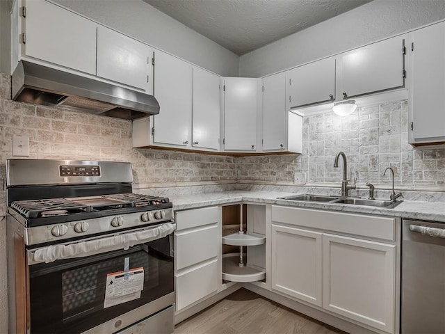 118 W Marshall Dr, Oklahoma City, OK 73110 - kitchen with stainless steel appliances, ventilation hood, tasteful backsplash, light wood finished floors, and light stone countertops
