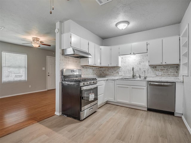 118 W Marshall Dr, Oklahoma City, OK 73110 - kitchen featuring appliances with stainless steel finishes, ceiling fan, under cabinet range hood, tasteful backsplash, and a textured ceiling