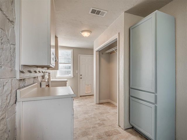 118 W Marshall Dr, Oklahoma City, OK 73110 - kitchen featuring light countertops and light stone finish floors
