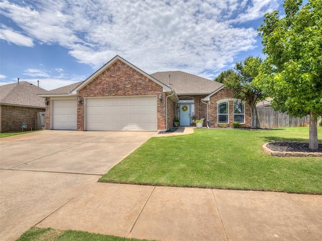 749 Dana Dr, Yukon, OK 73099 - view of front of property with a garage, concrete driveway, brick siding, and roof with shingles