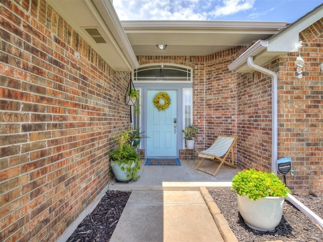 749 Dana Dr, Yukon, OK 73099 - doorway to property featuring brick siding