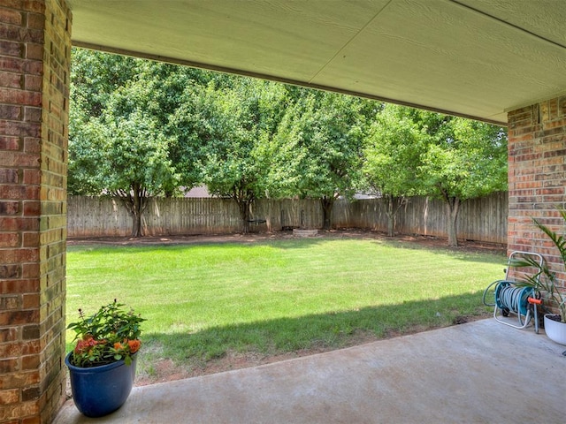 749 Dana Dr, Yukon, OK 73099 - fenced backyard with a patio area