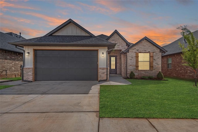 1224 Colonial Ave, Tuttle, OK 73089 - view of front of home with concrete driveway, brick siding, board and batten siding, and a lawn