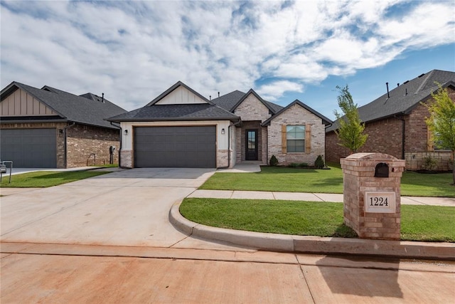1224 Colonial Ave, Tuttle, OK 73089 - view of front facade featuring board and batten siding, driveway, a garage, and a front yard