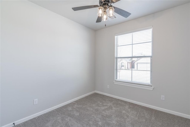 1224 Colonial Ave, Tuttle, OK 73089 - carpeted empty room with plenty of natural light and ceiling fan