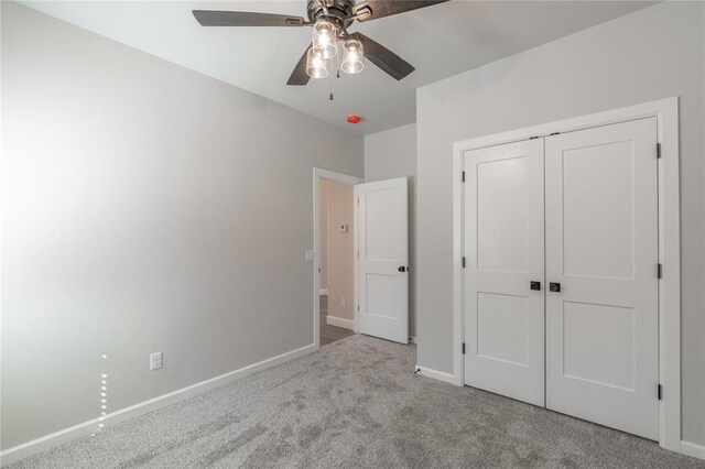 1224 Colonial Ave, Tuttle, OK 73089 - unfurnished bedroom featuring carpet floors, a closet, and a ceiling fan