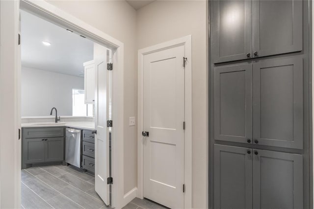 1224 Colonial Ave, Tuttle, OK 73089 - hall featuring a sink and baseboards