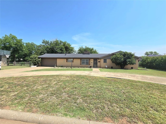 2015 Willard Dr, Altus, OK 73521 - ranch-style house with concrete driveway and an attached garage