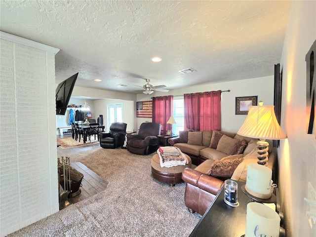 2015 Willard Dr, Altus, OK 73521 - carpeted living room featuring a textured ceiling, a ceiling fan, and recessed lighting