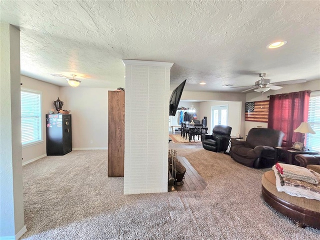 2015 Willard Dr, Altus, OK 73521 - living room with carpet flooring, a textured ceiling, recessed lighting, and ceiling fan