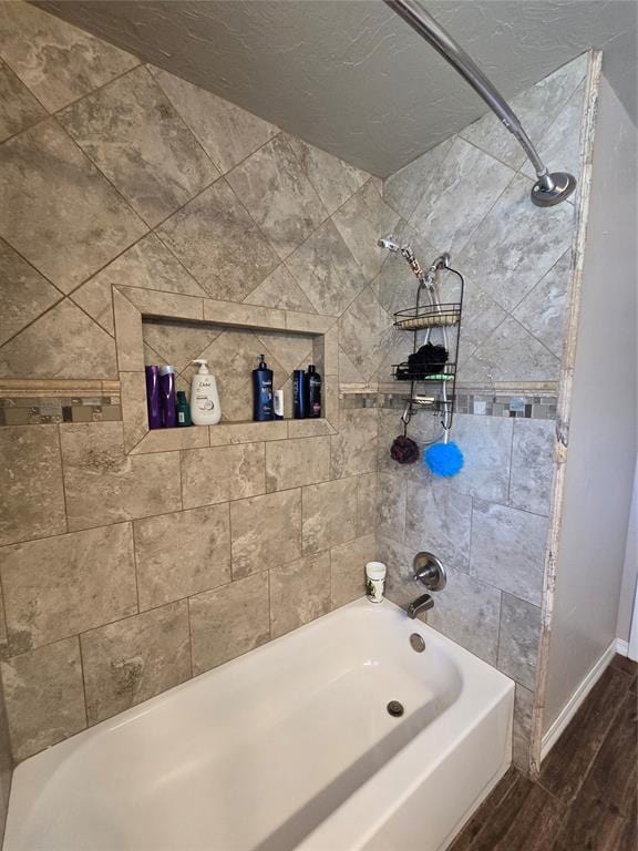 2015 Willard Dr, Altus, OK 73521 - bathroom with wood finished floors and shower / bath combination