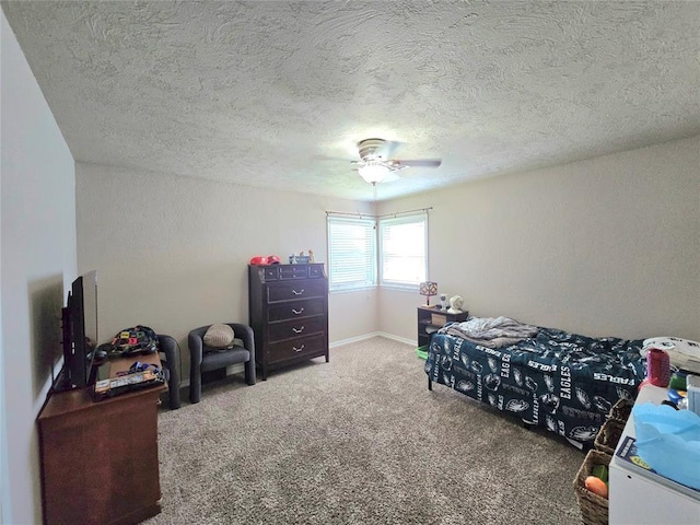 2015 Willard Dr, Altus, OK 73521 - bedroom with carpet flooring, a textured ceiling, a ceiling fan, and a textured wall