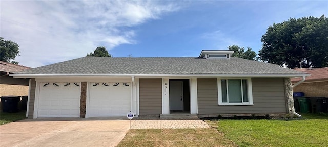 8317 NW 85th St, Oklahoma City, OK 73132 - view of front of property featuring concrete driveway, a garage, and a front yard