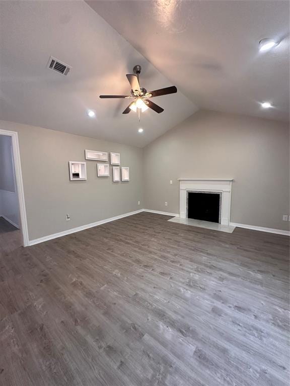 8317 NW 85th St, Oklahoma City, OK 73132 - unfurnished living room with a ceiling fan, lofted ceiling, dark wood finished floors, and a fireplace with flush hearth